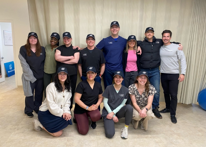 Our-Team-Momenutm-Health-National-Spine-team-in-caps-Momentum-Health-Evidence-Sport-and-Spine-Calgary-AB