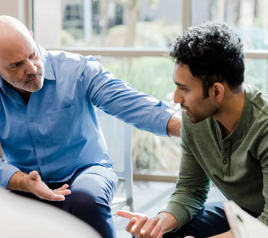 Occupational therapist meeting with a patient to discuss rehabilitation goals.