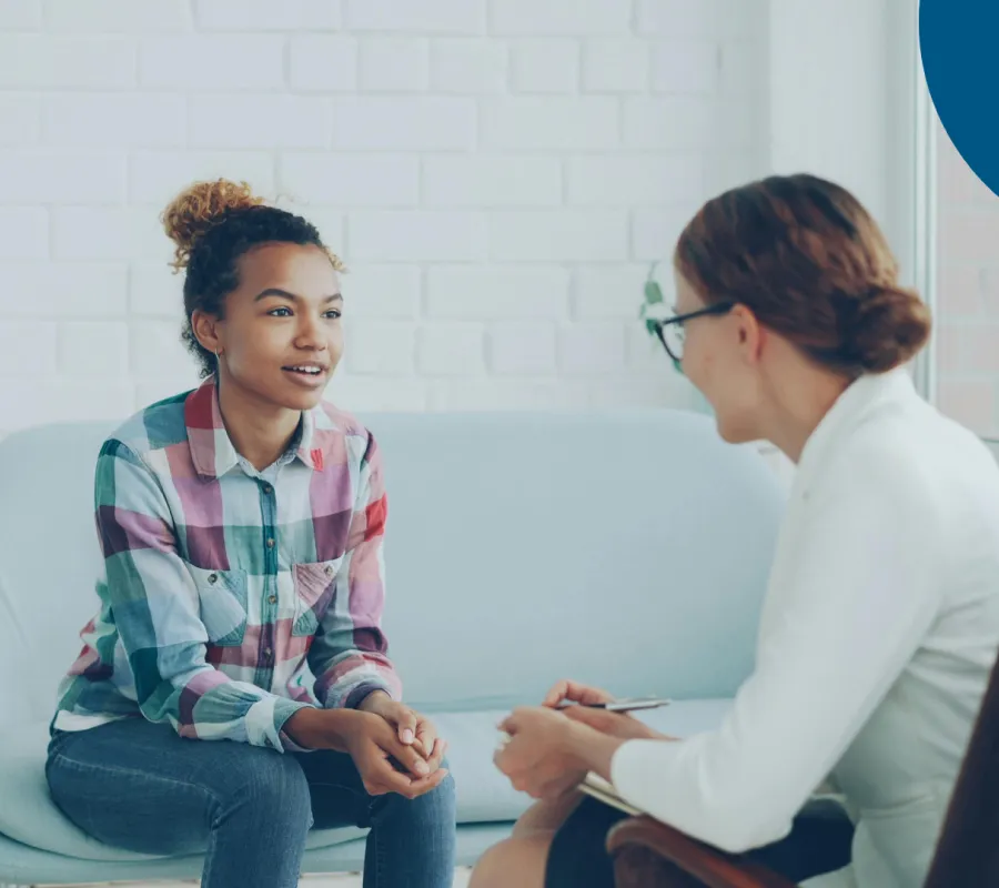 Occupational therapist meeting with a patient to discuss rehabilitation goals.